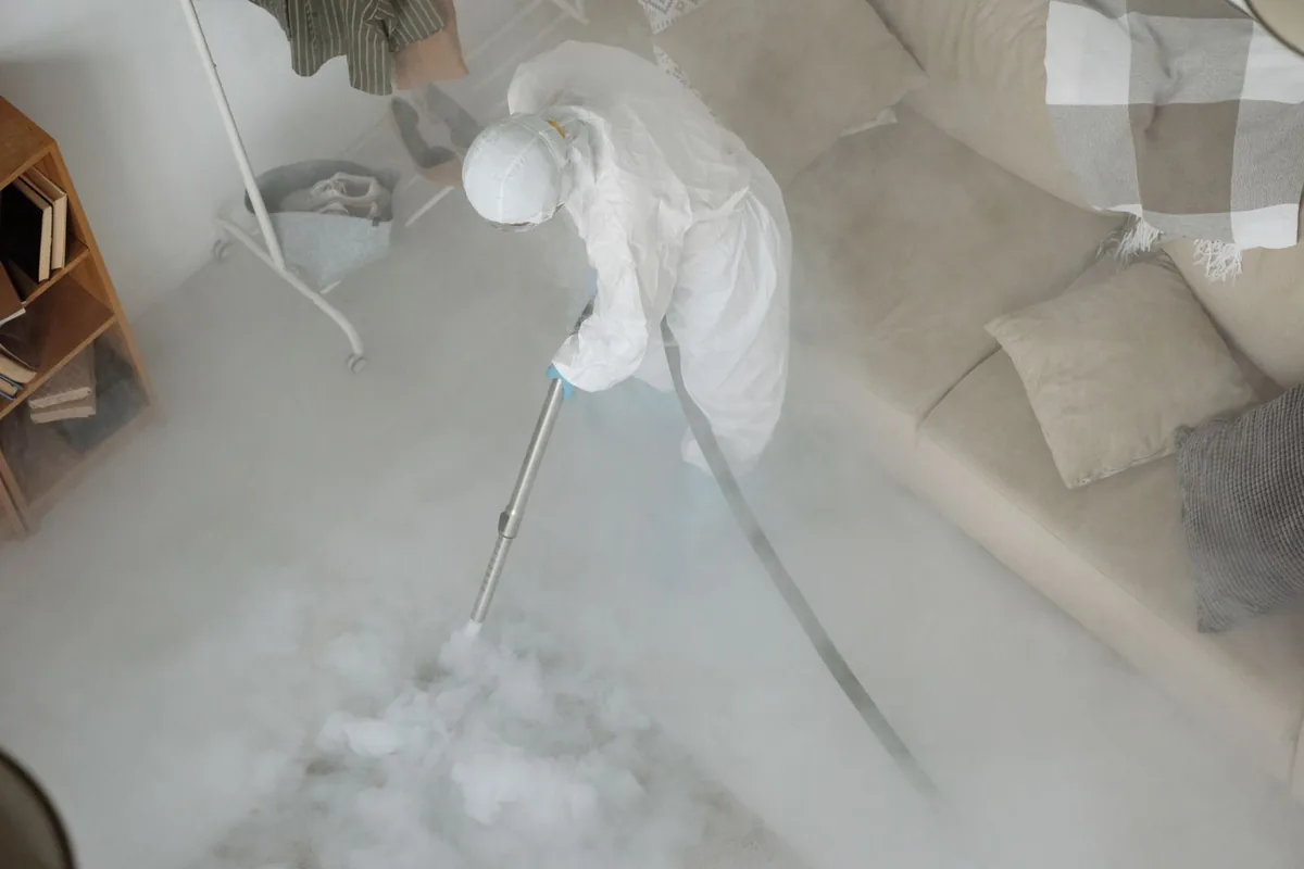 Biohazard cleanup technician in protective equipment, Friedens, PA